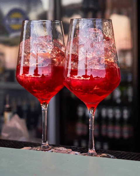 Spritz traditional cocktail with alcohol at a beach bar. European summer drink. Italian drink. Lifestyle concept