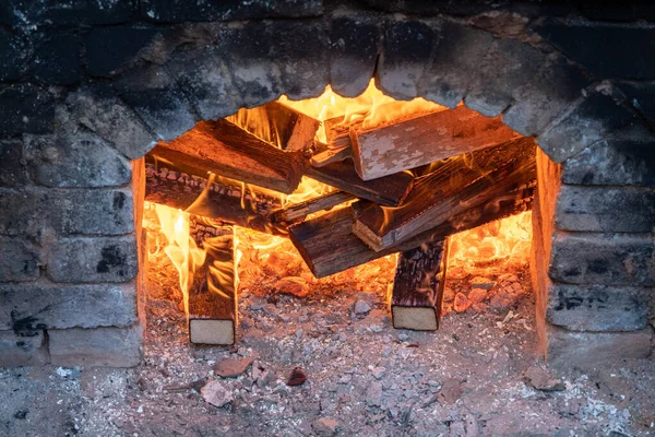 Firing of wood fire kiln is part of process for black pottery. Unique handmade pots and dishes of clay getting black after firing and oxygen reducing process in wood fire kiln. Latvian national crafts