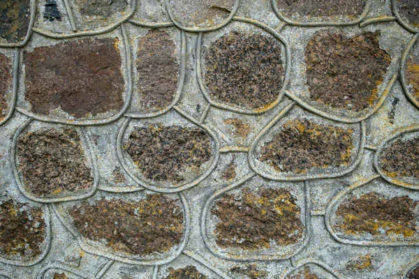 decorative brick wall of a country stone church.