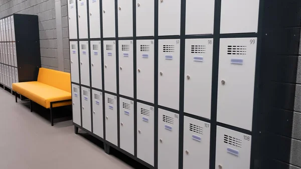 Storage cells for personal belongings. Key-type safe storage cabinet for sports centers, storage cabinet. A numbered storage box in a public place. Cells with metal locks, key with number