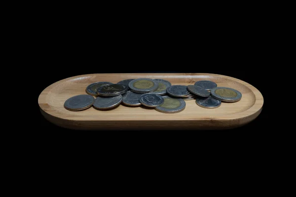 Coins Different Value Wooden Plate Black Background Isolation — Stock Photo, Image