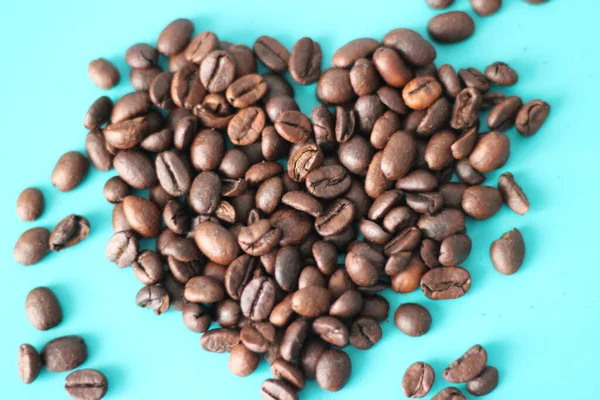 Heart Shaped Coffee Beans Cyan Pastel Texture Background Close Selective — Stock Photo, Image