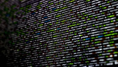 Colorful code background. compressed javascript code on computer screen. Software developer coding screen