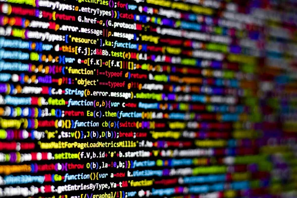 Colorful code background. compressed javascript code on computer screen. Software developer coding screen