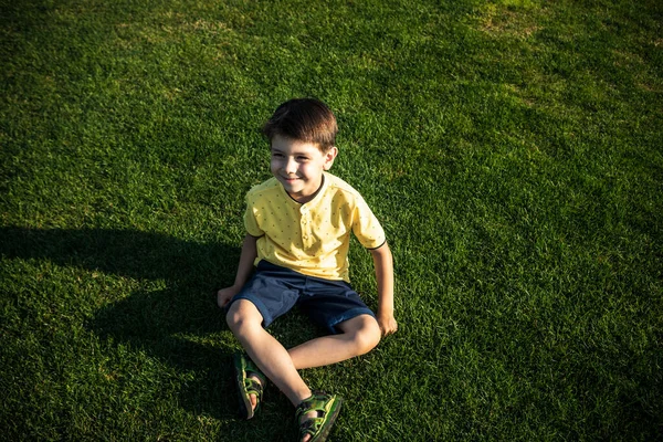 Young Boy Sitting Grass Kid Relaxation Nature Enjoy Warm Summer — Stock Photo, Image