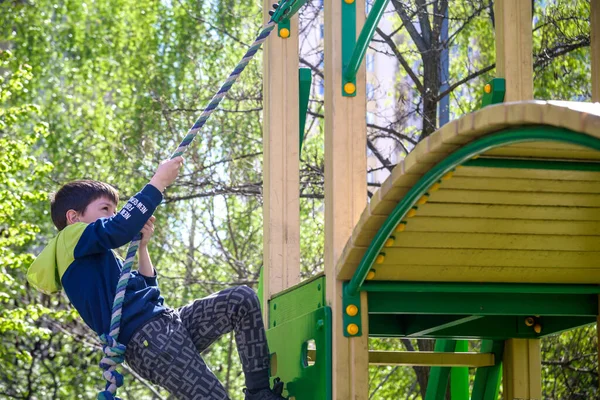 Teenager Boy Climbing Kid Playground Outdoor Climber Trains Simulator Street — Zdjęcie stockowe