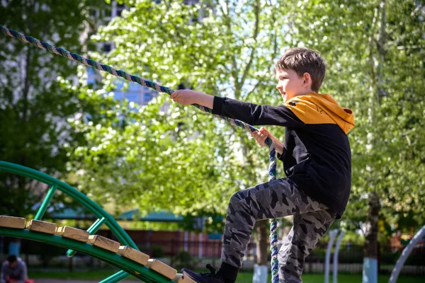 Teenager Boy Climbing Kid Playground Outdoor Climber Trains Simulator Street — Stock Photo, Image