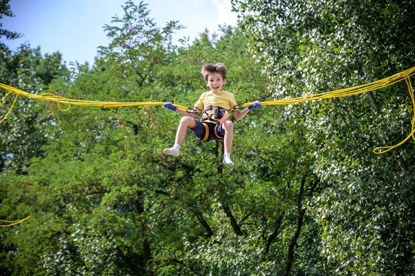 Boy Jumping Bungee Trampoline Child Insurance Stretchable Rubber Bands Hangs — Stock Photo, Image