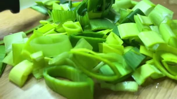 Asian cuisine vietnamese hot salad sao the whole exact cooking process from slicing to frying celery leeks pork or beef and cilantro it is very tasty all this cuts with a knife sip and interfere with — Stock Video