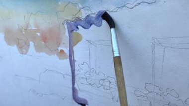 Sanatçı, erkek eliyle doğadaki ilk darbeyi vurmaya hazırlanıyor. Yüksek kalite 4k görüntü