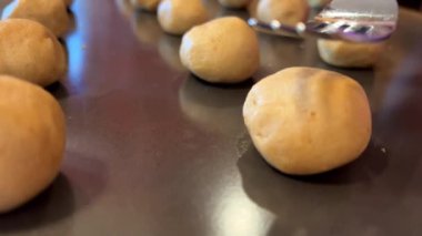 a fork crushes a circle of dough that will become a delicious appetizing shortbread cookie, it is crushed very soft and tender You just want to eat it making homemade cookies. High quality 4k footage