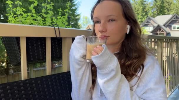 Teenage Girl Gray Hoodie Pulls Her Sleeves Her Arms Holds — Stockvideo