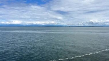the view from the ship of the liner the ship is sailing and we will see only the Horizon all that we can see is movement background For text, divided in half Canada to Vancouver Island Ferry