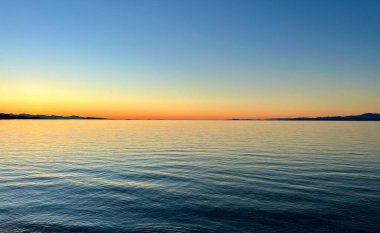 Beautiful sunset on the sea beach bright orange red coastline skyline High quality photo