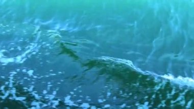 Sunbeams on the emerald green waters of the Pacific Ocean glisten in the sun background for any text travel advertising congratulations vacation trip holidays. High quality