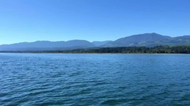 a view of a sailing ship on the sea and a horizon of dark blue the ocean and the sky can be both lake deep-water river in any country this landscape is similar ferry to Vancouver Islands yacht or boat