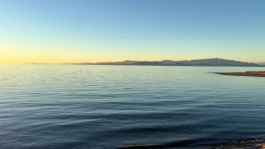 sunset against background of sea and sky and the horizon a strip of very bright rich red-orange color silence Calmness and relaxation evening on the Pacific Ocean Vancouver island tourist destination