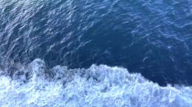 a journey across the Pacific Ocean on a liner, only the sea and water and the sky are visible, everything is blue, the horizon and a small part of the ship, rest on the water. High quality 4k footage