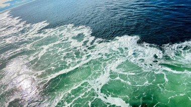 swatches of trasparent gel on green ash color background beauty hyaluronic acid or antibacterial gel. High quality photo