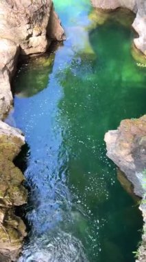 Traditional territory of the Kwalikum First Nation Little Qualicum Falls Provincial Park Clean clear and cold water Waterfall and Forest River The camera moves slowly Canada Vancouver Island.