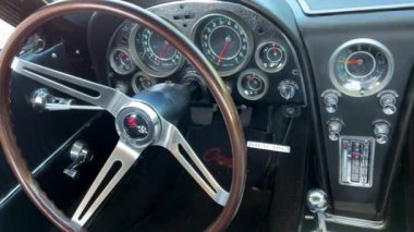 The steering wheel of an old rare scammer tears the camera slowly floats showing all the buttons and controls. High quality 4k footage 07.2022 canada