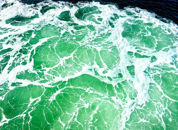 seamless green stone texture - abstract background Blue green sea with waves and foam. High quality photo