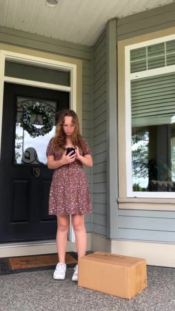 Girl Received Delivery Door She Stands Phone Her Hands Does — Video Stock