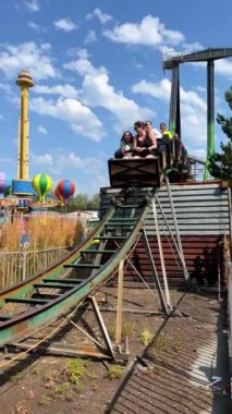 Roller coaster Pleasure park for children and adults swings and attractions Evening lights on swing Scary creepy swing in park Playland is an amusement park in Vancouver, British Columbia, Canada.