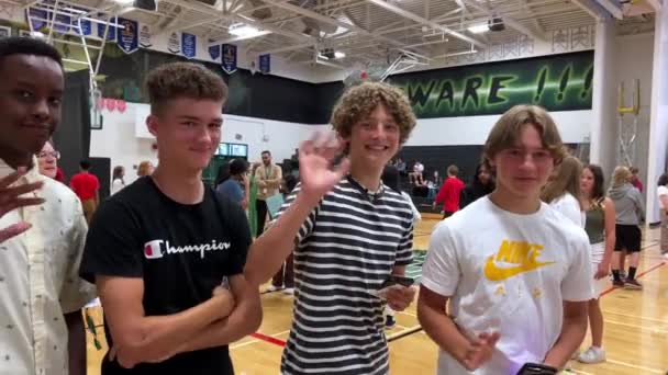 Four Boys Different Nationalities Stand Wave Frame Smile Turn Away — Video