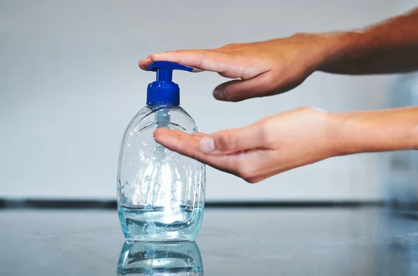 sanitizing hands with dispenser..sanitizing hands with liquid gel dispenser.