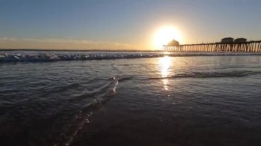 Low Angle of Waves on Beach at Newport Beach California at Sunset