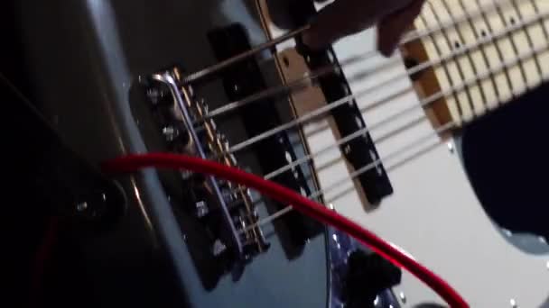 Close Bass Player Hand Plucking Electric Bass Strings — Video