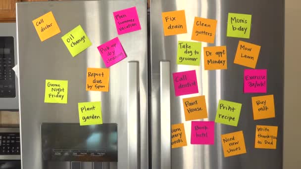 Refrigerator Filled Reminder Notes Hand Adds File Taxes Memo — Video Stock