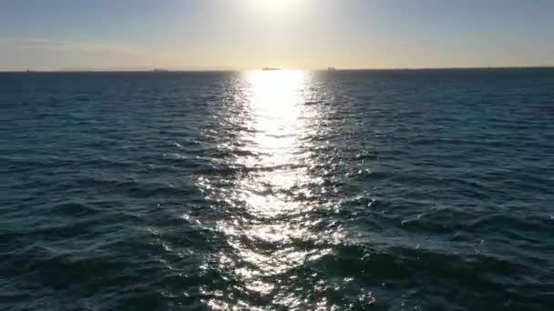 Drone Aerial Flying Fast Out Pacific Ocean Away Horizon Sun — Video