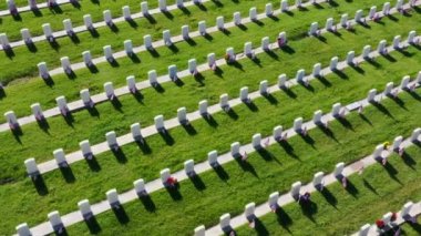 Drone Aerial Above a Military Cemetery Flying Around Rows of Headstones