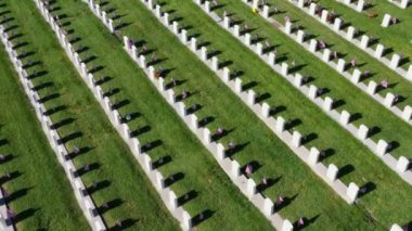 Drone Aerial Above a Military Cemetery Flying Around Rows of Headstones