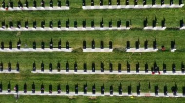 Drone Aerial Looking Directly Down and Descending to Headstone With American Flag
