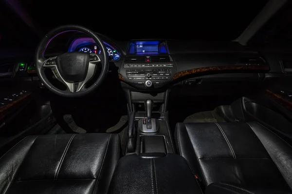 Interior of car with black leather upholstery