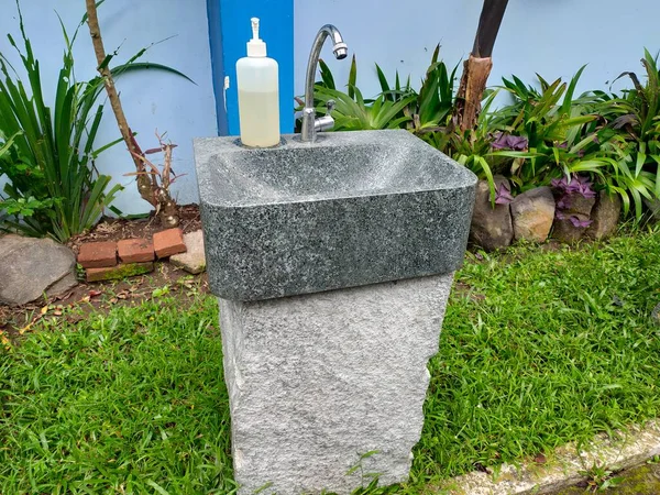 photo of hand washing with soap