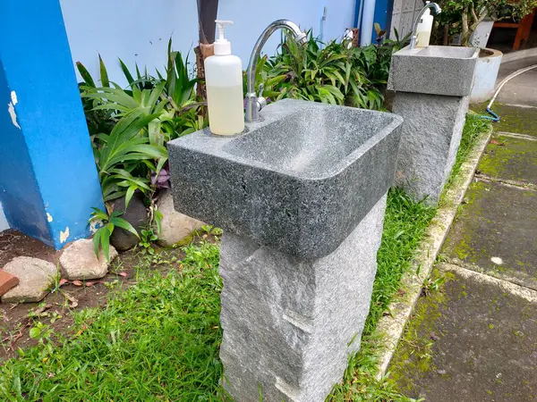 photo of hand washing with soap