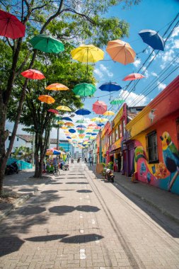 Pereira, Risaralda, Colombia. February 3, 2022: The famous meeting street in the city decorated with colored umbrellas. clipart
