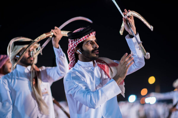 Doha,Qatar - December 18,2017. Traditional bedouin sword dancing for celebration Qatar national day.
