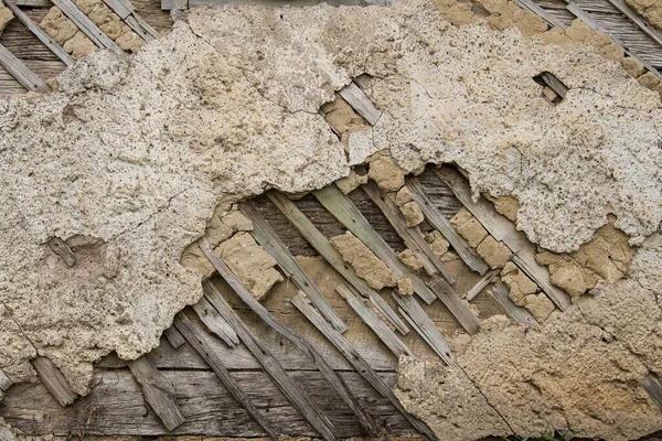 Croatia, April 20,2022 : Facade of mud and straw on old wooden house.