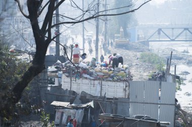 Kathmandu, Nepal,  April 20,2022 : Garbage and plastic pollution on the river bank in Kathmandu.