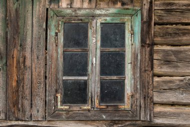 Croatia, May 01,2022 : Rustic style aged window at rural home wall.