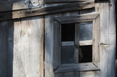 Croatia, May 01,2022 : Rustic style aged window at rural home wall.