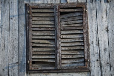 Croatia, May 01,2022 : Rustic style aged window at rural home wall.