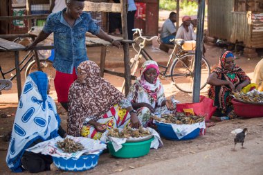 Zanzibar City, Tanzania - May 01,2022: Street view of the usual daily life of local people all ages taking place along the road on the Zanzibar Island in Tanzania.
