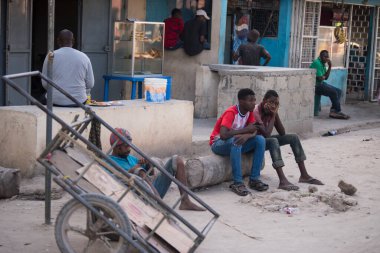 Zanzibar City, Tanzania - May 01,2022: Street view of the usual daily life of local people all ages taking place along the road on the Zanzibar Island in Tanzania.