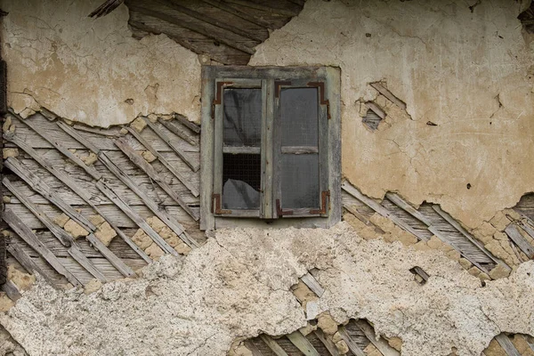 Croatia, October 20,2022 : Facade of mud and straw on old wooden house.